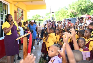 Principal of Crawford Primary & Infant School in St. Elizabeth, Shellian Madden (left), engages students in a devotional exercise at the start of the 2025/2026 academic year on Monday, September 8.

