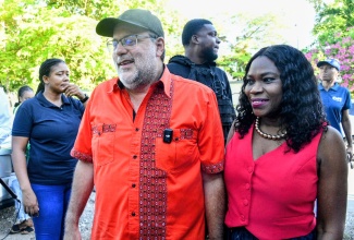 Leader of the Opposition, Mark Golding, and his wife, Sandra Golding, arrive at the polling station on Dillsbury Avenue in Jack’s Hill, St. Andrew North Eastern, to cast their votes in the 2025 General Election on Wednesday (September 3).

