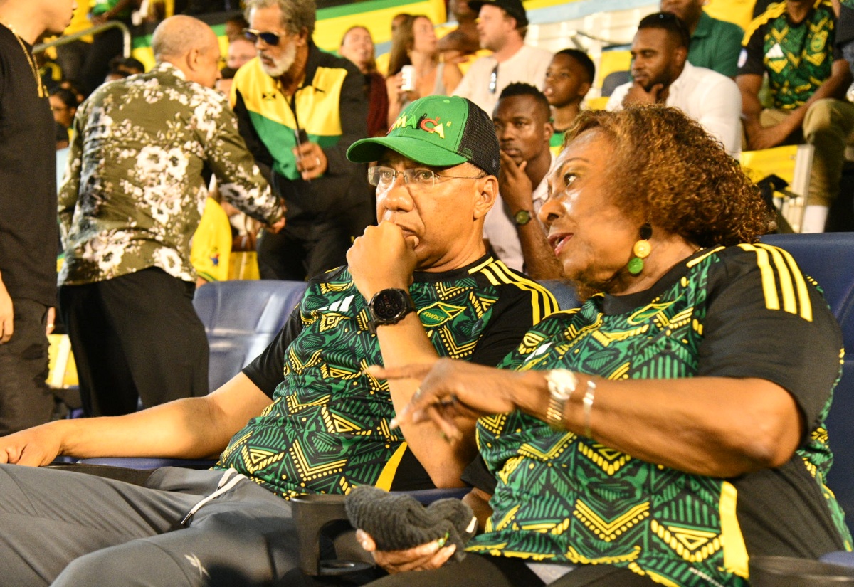 Prime Minister, Dr. the Most Hon. Andrew Holness (left), and Minister of Culture, Gender, Entertainment and Sport, Hon. Olivia Grange (right), share in conversation ahead of the CONCACAF World Cup Qualifier between Jamaica and Trinidad and Tobago at the National Stadium in Kingston on Tuesday (September 9). Jamaica’s Reggae Boyz claimed a 2-0 victory over Trinidad and Tobago to top their group.

