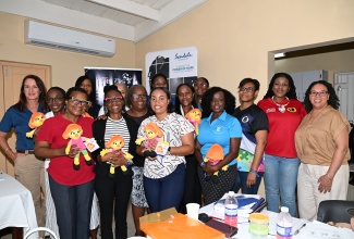 Trainees of the Autism and Developmental Needs Skills Training for Caregivers and Families programme, at the St. Ann's Bay Regional Hospital in St. Ann, on Wednesday, September 10. They are joined by Educators and organisers, among other stakeholders.


