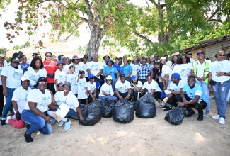 Volunteers of the Jamaica Civil Service Association (JCSA), St Ann Hi-Tech Farmer’s Group Ltd, Brown’s Town Community College, Fern Court High School, Social Development Commission (SDC), Grand Bahai Principe and other entities, display bags of garbage collected from Red Cross Peach Beach in Discovery Bay, St. Ann, during cleanup activities in observance of International Coastal Cleanup Day 2025 on September 20.