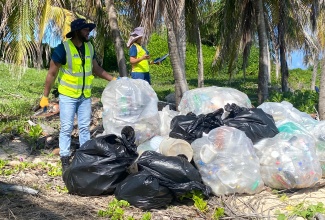 Mayor of Montego Bay, Councillor Richard Vernon, participates in International Coastal Clean-up Day activities held at Turtle Beach in Rose Hall, Montego Bay, on September 20.  