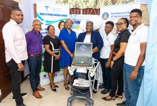 Officers of Medical X-Ray Institute, DBJ, the Custos of St. Catherine, pose with the state-of-the-art Ultrasound Machine.  (L to R)  

Dwayne Jackson, Director, Medical X-Ray Institute, Ravi Rambarran, Chairman, Medical X-Ray Institute, Mrs. Icylin Golding, Custos of St. Catherine, Dr. Jacqueline Campbell, CEO, 6 West Medical, Winsome Turner, Manager, Medical X-Ray Institute, Zelris Lawrence, Technical Officer, Grants, DBJ, Lu'Shana Cheddesingh, Project Coordinator, BIGEE, DBJ and Carlton Dunkley, Technical Officer, Grants, BIGEE, DBJ. 