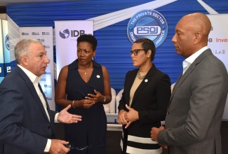 President of the Private Sector Organisation of Jamaica (PSOJ), Metry Seaga (left), converses with from (second left) Executive Director of the PSOJ, Sacha Vaccianna-Riley; Deputy Managing Director, Jamaica National (JN) Bank, Gillian Hyde, and Managing Director of the Development Bank of Jamaica (DBJ), David Lowe. The interaction took place on the sidelines of the PSOJ & Inter-American Development Bank (IDB) Empower JA Forum, held at The Jamaica Pegasus hotel in Kingston on Thursday (September 11).

