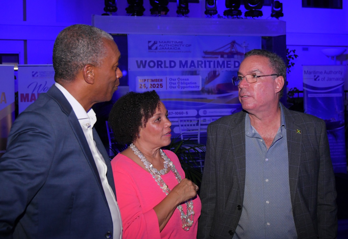 Minister of Transport, Telecommunications and Energy, Hon. Daryl Vaz (right), in discussion with Director General of the Marine Authority of Jamaica, Bertrand Smith; and Chair of the Marine Authority of Jamaica, Corah Ann Robertson Sylvester, at the Maritime Authority of Jamaica’s Illuminating Ceremony and Cocktail Reception in recognition of World Maritime Day, on Thursday (September 25), at the  Ministry of Foreign Affairs and Foreign Trade, in downtown Kingston.