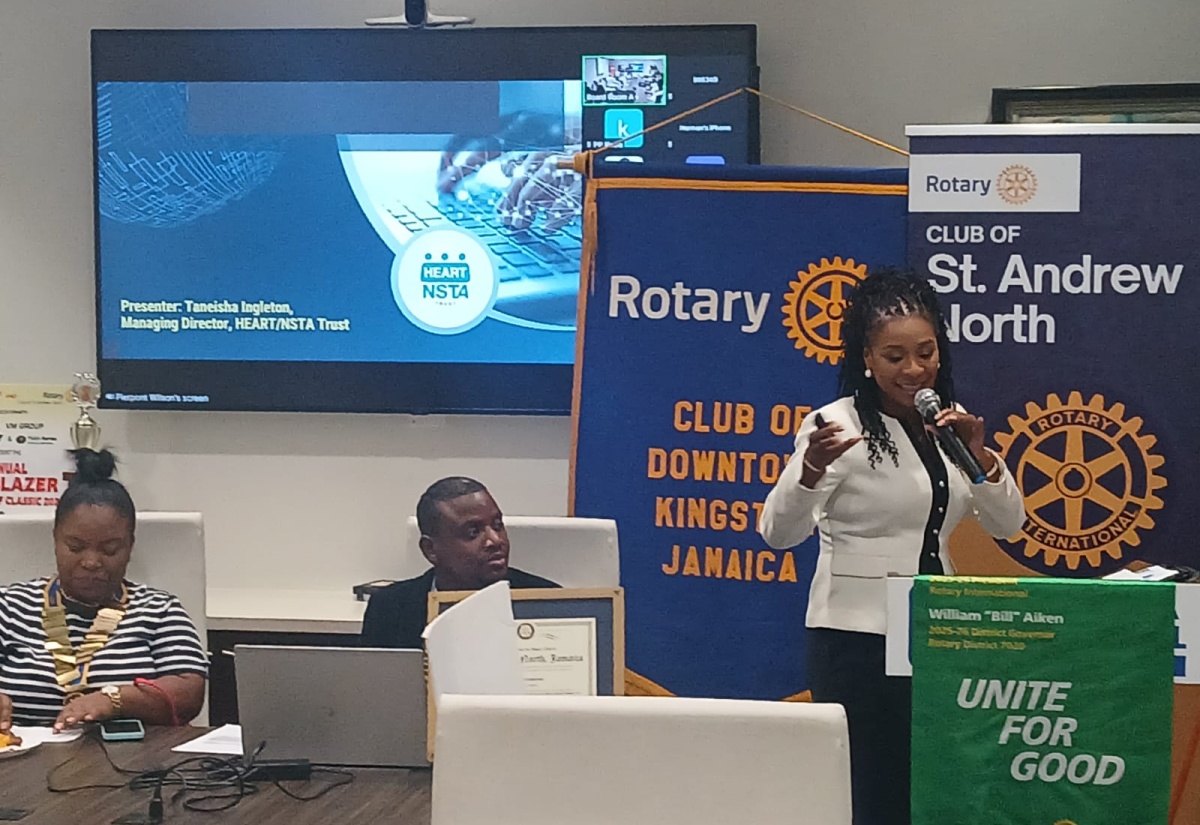 Managing Director of the HEART/NSTA Trust, Dr. Taneisha Ingleton (right), gives the main address at a joint meeting of the Rotary Clubs of St. Andrew North & Downtown Kingston at the Jamaica National (JN) Conference Suites in Kingston, on Monday (September 22). Listening keenly are (from left):  President of the Rotary Club of Downtown Kingston, Shawna Brown and President of the Rotary Club of St Andrew North, Pierpont Wilson.

 