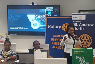 Managing Director of the HEART/NSTA Trust, Dr. Taneisha Ingleton (right), gives the main address at a joint meeting of the Rotary Clubs of St. Andrew North & Downtown Kingston at the Jamaica National (JN) Conference Suites in Kingston, on Monday (September 22). Listening keenly are (from left):  President of the Rotary Club of Downtown Kingston, Shawna Brown and President of the Rotary Club of St Andrew North, Pierpont Wilson.

 