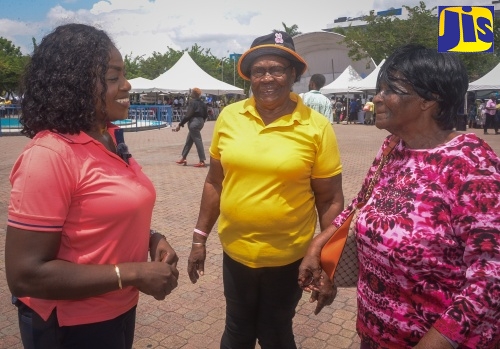 Executive Director of the National Council for Senior Citizens (NCSC), Cassandra Morrison (left), speaks with Trelawny Senior Citizens’ Club members, Casminth Robinson (centre) and Ivy Barrett, during an Ageing Fair held on Thursday (Sept. 11) at Emancipation Park in St. Andrew. The event formed part of the activities for Senior Citizens’ Month, being observed from September 1 to October 1 under the theme: ‘Respect, Protect, Empower, Connect.’