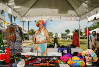 A local artisan proudly displays her products during the 2024 staging of the Tourism Product Development Company’s (TPDCo) ‘Craft with a Difference’ showcase at Harmony Beach Park in Montego Bay.