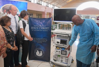 Consultant Surgeon at Mandeville Regional Hospital in Manchester, Dr. Andrew Josephs (right), demonstrates the capabilities of a newly donated Storz Urology Laparoscopy system, presented by the Church of Jesus Christ of Latter-day Saints, during the formal handover on Friday (September 5). Others (from left) are: Food For the Poor Board Director, Jean Lowrie-Chin; and the Church’s representative, Elder Paul Sutherland, and Humanitarian Missionary, Sister Karen Sutherland.