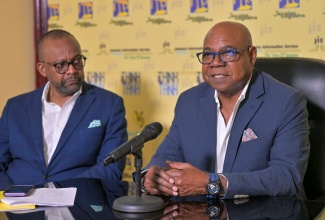 Tourism Minister, Hon. Edmund Bartlett (right), and Tourism Director at the Jamaica Tourist Board (JTB), Donovan White, participate in a Jamaica Information Service (JIS) ‘Think Tank’ held last year to outline activities for Tourism Awareness Week and World Tourism Day.

