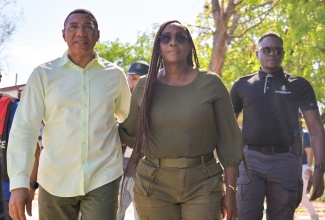 Prime Minister, Dr. the Most Hon. Andrew Holness (left), and his wife, Speaker of the House of Representatives, the Most Hon. Juliet Holness (right), arrive at the polling station at Mona High School in St. Andrew Eastern to cast their votes in the 2025 General Election on Wednesday (September 3).

