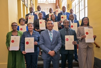 Prime Minister, Dr. the Most Hon. Andrew Holness (front row, centre ), is flanked by State Ministers and Parliamentary Secretary, who were sworn into office during a ceremony at King’s House on Friday (September 19).