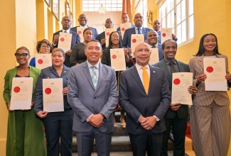 Governor-General, His Excellency the Most Hon. Sir Patrick Allen (front row, fourth left) and Prime Minister, Dr. the Most Hon. Andrew Holness (front row, third left), are flanked by State Ministers and one Parliamentary Secretary, who were sworn into office during a ceremony at King’s House on Friday (September 19).