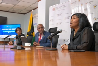 Minister of Industry, Investment and Commerce, Senator the Hon. Aubyn Hill, and Permanent Secretary in the Ministry, Sancia Bennett Templer (left), listen attentively as Chief Executive Officer and Registrar of Companies at the Companies Office of Jamaica (COJ), Shellie Leon, outlines key developments during a press conference held at the Ministry’s offices in New Kingston on Tuesday (September 23).

