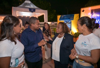 Minister of Agriculture, Fisheries and Mining, Hon. Floyd Green, converses with Minister of Culture, Gender, Entertainment and Sport, Hon Olivia Grange (second right), during the Jamaica Food and Drink Festival 2025 media launch on September 26 at the Jamaica Pegasus Hotel in New Kingston. Looking on (from left) are Festival Directors, Nicole Pandohie, and Alicia Bogues.

