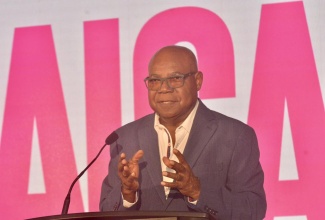 Minister of Tourism, Hon. Edmund Bartlett, addresses tourism stakeholders and business interests at the Jamaica Product Exchange tradeshow, at the Jewel Grande in Montego Bay, St. James, on September 23.