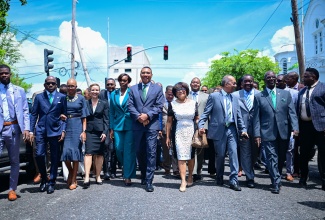 Prime Minister, Dr. the Most Hon.  Andrew Holness (fifth left), leads Government ministers down Duke Street for the ceremony for the opening of the new Parliament and the swearing in of members of the Senate and House of Representatives at Gordon House on Thursday (September 18).


