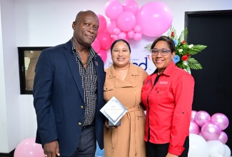 Director, Corporate Services, Jamaica Information Service (JIS), Errol Gardner, and Administrative Assistant, JIS, Andrea Salmon Spence (centre), share a moment with Accountant General, Anya Jones. Occasion was the Accountant General’s Department (AGD) Ministries, Departments, and Agencies (MDA) Awards Brunch, held on Friday (October 10) at the Department in New Kingston. The JIS was awarded for timely and consistent submission of quarterly credit card reports.