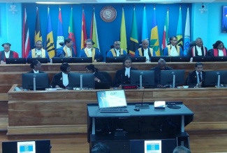 Members of the judiciary and staff of the Caribbean Court of Justice (CCJ) participate in a special sitting to commemorate the inauguration of President, Hon. Mr. Justice Winston Anderson. The ceremony was held at the Seat of the CCJ in Port of Spain, Trinidad, on Monday (October 6).

