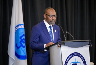 President of the Caribbean Court of Justice (CCJ), Hon. Mr. Justice Winston Anderson, addresses stakeholders during his swearing-in ceremony at the Jewel Grande Resort in Montego Bay, St. James, on July 6.

