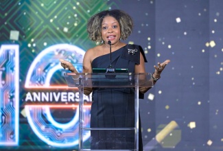 Minister of Education, Skills, Youth and Information, Senator Dr. the Hon. Dana Morris Dixon, speaks at the Amber Group’s 10th anniversary celebration & artificial intelligence (AI) robotics showcase, held at the AC Hotel in Kingston on Tuesday (October 14).

