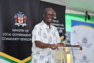 Minister of Local Government and Community Development, Hon. Desmond McKenzie, delivers remarks during a ceremony to hand over a home under the Indigent Housing Programme, on Beresford Street in St. Andrew South.