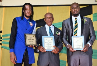 The three honourees of the Heritage Flag-Raising Ceremony held at Independence Park in Black River, St. Elizabeth, on National Heroes Day, Monday, October 20. From left are ice cream vendor Aladean Stewart; Deputy Mayor of Black River and Councillor for the Malvern Division, Donald Simpson; and Deputy Chief Executive Officer of Intown Super Centre, Ryan Lloyd.