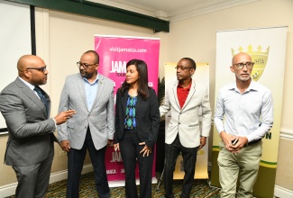 Chief Executive Officer of the Kingston and St. Andrew Municipal Corporation (KSAMC) and Town Clerk, Robert Hill (left), engages in conversation with (from second left) Director of Tourism at the Jamaica Tourist Board (JTB), Donovan White; Kingston City Run Co-founder and Organising Committee Co-Chair, Nicola Madden-Greig; President, Jamaica Hotel & Tourist Association (JHTA), and Co-Chair & Co-Founder, Kingston City Run, Christopher Jarrett; and Race Director, Alan Beckford. The occasion was the launch of the 2025 Kingston City Run (KCR) on Thursday (October 9) at the Courtleigh Hotel and Suites in Kingston.

