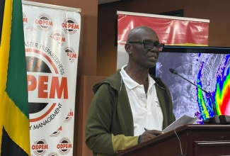 Minister of Local Government and Community Development, Hon. Desmond McKenzie speaking during at a press briefing at the National Emergency Operations Centre (NEOC), located at the Office of Disaster Preparedness and Emergency Management (ODPEM) in Kingston, on October 28.