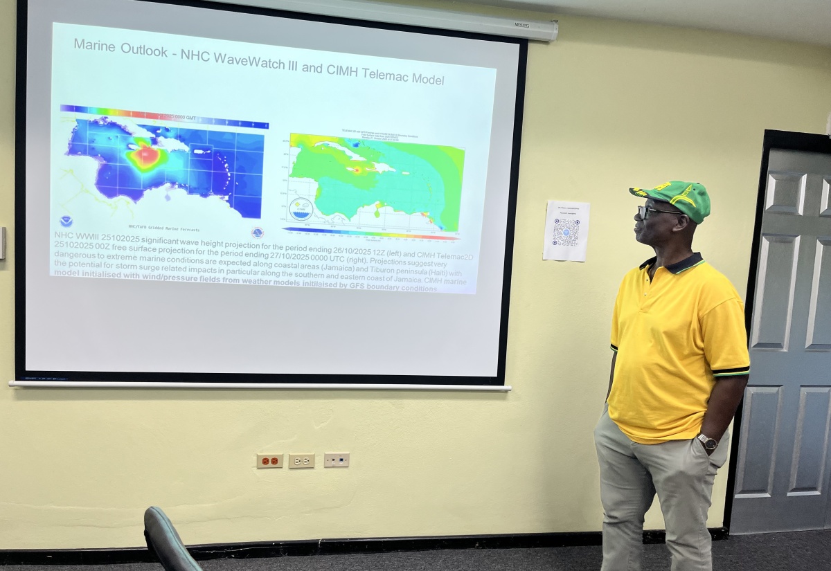 Minister of Local Government and Community Development, Hon. Desmond Mckenzie, looks at the forecast track for Hurricane Melissa during a visit to the National Emergency Operations Centre (NEOC) located at the Office of Disaster Preparedness and Emergency Management (ODPEM) in Kingston on Saturday (Oct. 26).
