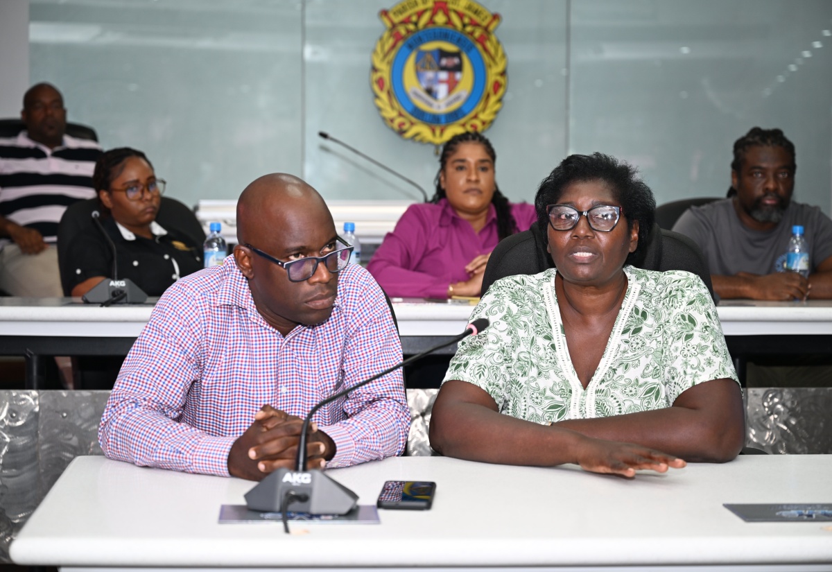 Inspector of Poor for St. James, Pauline Lecky, addresses the Emergency Operations Centre (EOC) meeting at the St. James Municipal Corporation on Thursday (October 23). Looking on is Public Assistance Division (PAD) Administrator at the Ministry of Labour and Social Security, Andrae Earle.