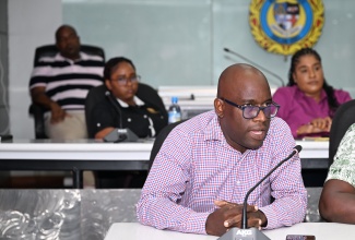 Public Assistance Division (PAD) Administrator at the Ministry of Labour and Social Security, Andrae Earle, addresses the Emergency Operations Centre (EOC) meeting at the St. James Municipal Corporation on Thursday (October 23).

