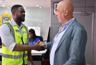 Mayor of Montego Bay, Councillor Richard Vernon (left), greets Spanish Ambassador to Jamaica, His Excellency José María Fernández López de Turiso, during an Emergency Operations Centre meeting held at the St. James Municipal Corporation in Montego Bay on Thursday (October 30).
