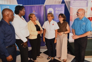 State Minister in the Ministry of Health and Wellness, Hon. Krystal Lee (third left), and Chief Education Officer in the Ministry of Education, Skills, Youth and Information, Terry Ann Thomas Gayle (second left), interact with stakeholders, during the Heart Foundation of Jamaica (HFJ) ‘Let’s Implement the National School Nutrition Policy’ Mass Media Campaign Launch, held recently at the Terra Nova All-Suite Hotel in St. Andrew. Sharing the moment (from left) are President of the Paediatric Association of Jamaica, Dr. Ludrick Morris; HFJ Executive Director, Deborah Chen; United Nations Children’s Fund (UNICEF) Jamaica Country Representative, Olga Isaza; and Pan American Health Organization/World Health Organization (PAHO/WHO) Representative for Jamaica, Ian Stein.

