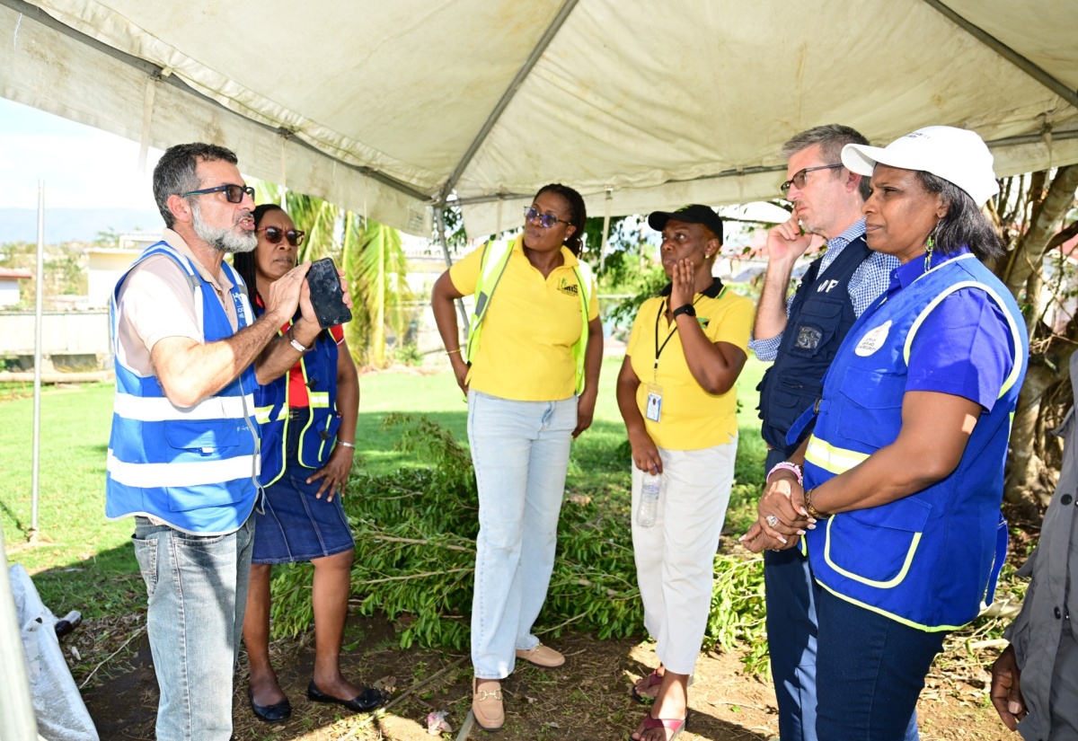Permanent Secretary in the Ministry of Labour and Social Security, Dionne Jennings (right); and Caribbean Country Director, World Food Programme (WFP), Brian Bogart (second right), listen to a comment from Food For the Poor Director in charge of operations and implementation, Nakhle Hado, during a tour of St. Elizabeth on Thursday (October 30). Sharing in the conversation (from second left) are Acting Director for Disaster, Rehabilitation and Welfare Management in the Ministry, Jacqueline Shepherd; Director of Social Security in the Ministry, Suzette Morris; and the Ministry