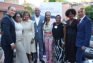 Minister of Health and Wellness, Dr. The Hon. Christopher Tufton (left), and Jamaica’s Ambassador to the United States, His Excellency Major General (ret’d) Antony Anderson (right), share lens with RalRosa Foundation Board Members (from second left) Courtni Foster, Kim Watson, Richard Watson, Dr. Jacqueline Watson (President), Nicole Shirley, and Dr. Nicole Kboba. The occasion was a reception hosted by the Foundation in honour of Ambassador Anderson, in Georgetown, Washington DC, on October 1.