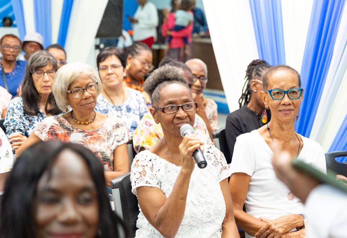 Participants engage in a lively question-and-answer session during a semi-virtual Artificial Intelligence (AI) Empowerment Workshop for seniors, hosted recently by the Broadcasting Commission, Jamaica Library Service (JLS), Digicel Foundation, and other stakeholder partners, at the Kingston and St. Andrew Parish Library. The event formed part of activities commemorating National Senior Citizens’ Month throughout September.

