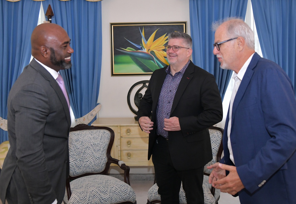 Minister without Portfolio in the Office of the Prime Minister with Responsibility for Science, Technology and Special Projects, Dr. the Hon. Andrew Wheatley (left), interacts with Chairman, Pan Jamaica Group, Stephen Facey (right), and guest speaker for the 2025 Maurice Facey Lecture, Brent Toderian, during a courtesy call at the Office of the Prime Minister on Wednesday (October 8). 

