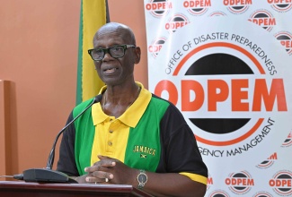 Minister of Local Government and Community Development, Hon. Desmond McKenzie, addresses a press briefing at the National Emergency Operations Centre (NEOC) of the Office of Disaster Preparedness and Emergency Management (ODPEM) in Kingston on Monday (October 27).