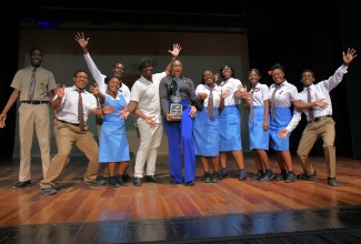 The Ardenne High School team celebrates the institution's 15th hold on the Jamaica Cultural Develpment Commission's (JCDC) Marcus Garvey Award for Excellence in the Performing Arts, at the 2025 presentation ceremony held at the Little Theatre in Kingston on Wednesday (October 15).  Extracurricular Coordinator at Ardenne High School, Zia Gray (centre) holds the trophy.

