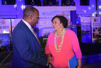 Under Secretary for the Foreign Trade Division in the Ministry of Foreign Affairs and Foreign Trade and Jamaica’s Ambassador to the Caribbean Community (CARICOM), Esmond Reid, greets Chair of the Marine Authority of Jamaica (MAJ), Corah Ann Robertson Sylvester, during the MAJ’s Illuminating Ceremony and Cocktail Reception in recognition of World Maritime Day on September 25. The event was held at the Ministry in downtown Kingston.
