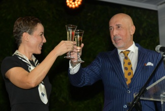 Minister of Foreign Affairs and Foreign Trade, Senator the Hon. Kamina Johnson Smith, and Spain's Ambassador to Jamaica, His Excellency José María Fernández López de Turiso, raise a toast during Spain’s National Day reception on Thursday (October 9). The reception was held at the Ambassador’s residence in St. Andrew.
