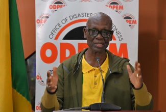Minister of Local Government and Community Development, Hon. Desmond McKenzie, addresses a press briefing at the National Emergency Operations Centre (NEOC), located at the Office of Disaster Preparedness and Emergency Management (ODPEM) in Kingston on Monday (October 27).