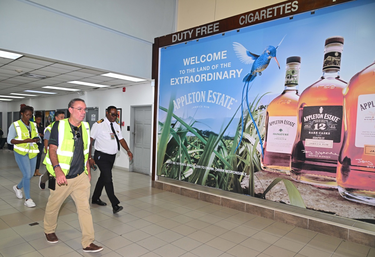 Minister of Energy,  Telecommunications and Transport, Hon. Dary Vaz (foreground), tours the Norman Manley International Airport (NMIA) in Kingston on Wednesday (October 29) in the wake of Hurricane Melissa. He is joined by Chief Executive Officer of PAC Kingston Airport Limited (PACKAL), Sitara English- Byfield (background left), and Director of Airport Operations at Jamaica Customs Agency, Devon Manahan (right). 

