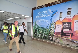 Minister of Energy,  Telecommunications and Transport, Hon. Dary Vaz (foreground), tours the Norman Manley International Airport (NMIA) in Kingston on Wednesday (October 29) in the wake of Hurricane Melissa. He is joined by Chief Executive Officer of PAC Kingston Airport Limited (PACKAL), Sitara English- Byfield (background left), and Director of Airport Operations at Jamaica Customs Agency, Devon Manahan (right).