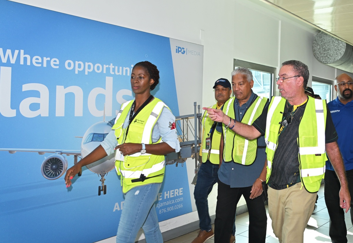Minister of Energy, Transport and Telecommunications, Hon. Daryl Vaz (second right), engages in discussion with Director General of the Jamaica Civil Aviation Authority (JCAA), Nari Williams-Singh (centre), and Chief Executive Officer of PAC Kingston Airports Limited, Sitara English-Byfield, during a stakeholder tour of Norman Manley International Airport in Kingston on Wednesday (October 29). The visit, led by Minister Vaz, assessed the facility’s readiness to resume operations following the passage of Hurricane Melissa on Tuesday (October 28). Also pictured (from second left) are President and Chief Executive Officer of the Airports Authority of Jamaica, Audley Deidrik, and Chief Information Officer at the Jamaica Customs Agency, André Williams.