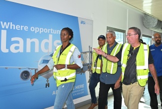 Minister of Energy, Transport and Telecommunications, Hon. Daryl Vaz (second right), engages in discussion with Director General of the Jamaica Civil Aviation Authority (JCAA), Nari Williams-Singh (centre), and Chief Executive Officer of PAC Kingston Airports Limited, Sitara English-Byfield, during a stakeholder tour of Norman Manley International Airport in Kingston on Wednesday (October 29). The visit, led by Minister Vaz, assessed the facility’s readiness to resume operations following the passage of Hurricane Melissa on Tuesday (October 28). Also pictured (from second left) are President and Chief Executive Officer of the Airports Authority of Jamaica, Audley Deidrik, and Chief Information Officer at the Jamaica Customs Agency, André Williams.