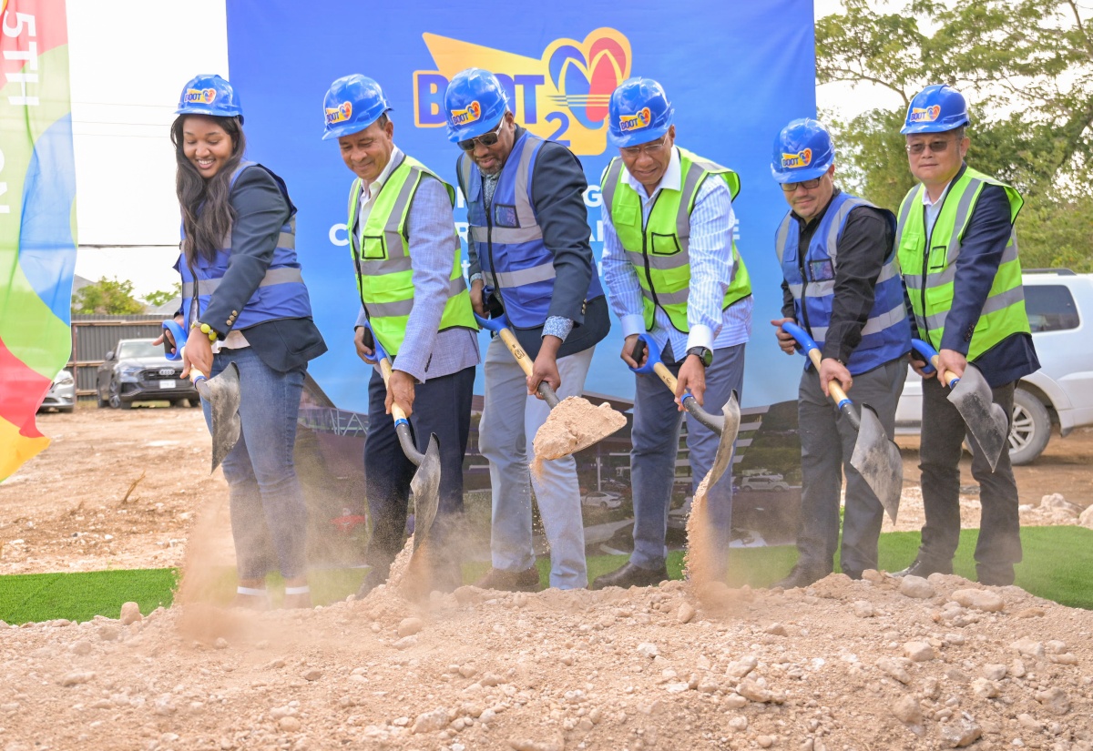 Prime Minister, Dr. the Most Hon. Andrew Holness (third right) breaks ground for the construction of a 68,000 square foot three-story Boot 2 commercial complex in Drax Hall, St. Ann, on Friday, October 10. He is joined by (from left) Chief Executive Officer of Boot, Alexcia Boothe; Architect of Boot 2, Leighton Hamilton; Owner and Operator of Boot Service Station, Wayne Boothe; Minister of Water, Environment and Climate Change, Hon. Matthew Samuda; and Managing Director of Henan Fifth Construction Group, Riulin Ji.