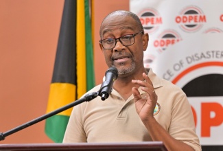 Principal Director of the Meteorological Services Branch in the Ministry of Water, Environment and Climate Change, Evan Thompson, provides an update on Hurricane Melissa from the National Emergency Operations Centre (NEOC) during a media briefing at the Office of Disaster Preparedness and Emergency Management (ODPEM) in Kingston.